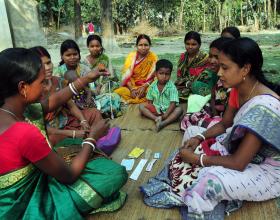 Source - © 2016 Tushar Sharma, Courtesy of Photoshare. Description - A rural health worker teaches women about the IUD and other contraceptive methods at a remote village in Kushamandi, South Dinajpur, West Bengal, India. 