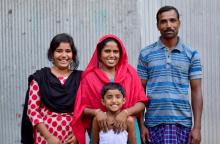 Milk collector Sabina with husband Vutto & two daughters, Maisha (left) and Manisha, in Nepaltoli, Bangladesh. Src - © 2014 Akram Ali, Courtesy of Photoshare. Milk collector Sabina with husband Vutto & two daughters, Maisha (left) and Manisha, in Nepaltoli, Bangladesh.